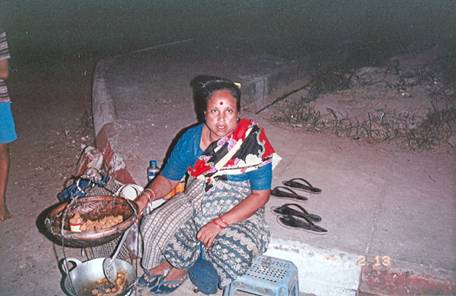 Tamil woman selling fried food by the roadside in Yangon 2007