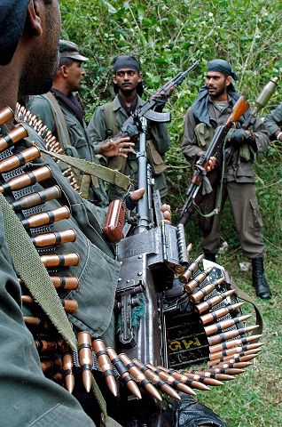 Agence France-Presse/Getty Images HUNTING TIGERS: Sri Lanka military commandos prepare for an operation against the separatist Tamil Tigers in June.