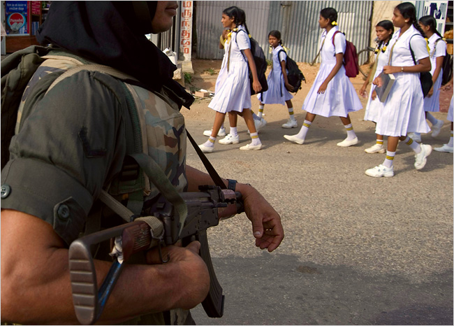 A government soldier patrolled the streets of Jaffna the morning after Tamil boats attacked government forces on a nearby island. Army commanders expect a major battle for Jaffna before the August monsoon. June 15, 2007