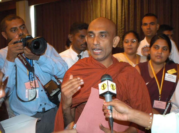 Jathika Hela Urumaya parliament group leader Rev. Athuraliye Rathana speaking to journalists at the Sri Lank Development Forum. TamilNet March 26 2008