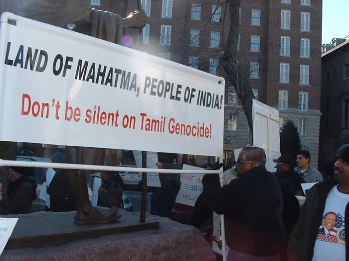 Slogan displayed below Gandhi statue January 2009 Washington DC