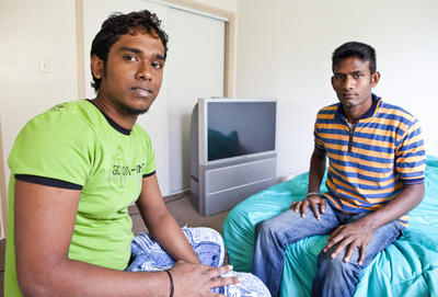 Nirohan Vivekananthan, age 22, and Vinoth Sivarajasingam, age 24, both formerly of Jaffna, Sri Lanka sit on their beds in their new home in Oakland, Calif. on Wednesday, June 2, 2010