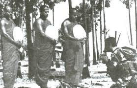 Buddhist monks blessing soldier at war front Sri Lanka 1998