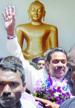 President Rajapakse and Buddha, November 2005
